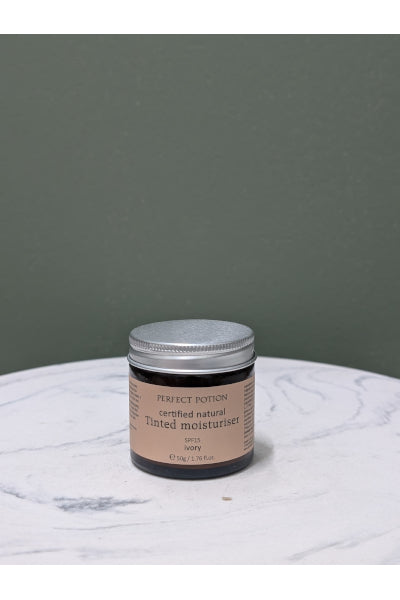 P/POTION TINTED MOISTURISER IVORY 50ML